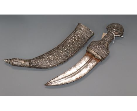 A white metal overlaid dagger