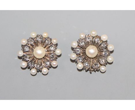 A pair of yellow metal, diamond and seed pearl cluster ear clips, 17mm.