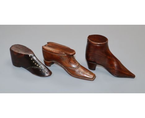 Two treen snuff shoes and a model shoe