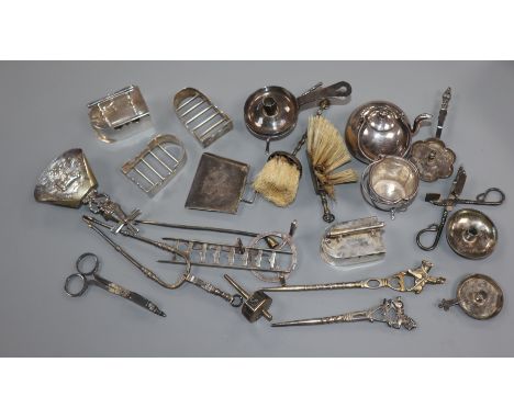 A Dutch miniature white metal kettle and a collection of other miniature novelties, including two irons with stands, two triv