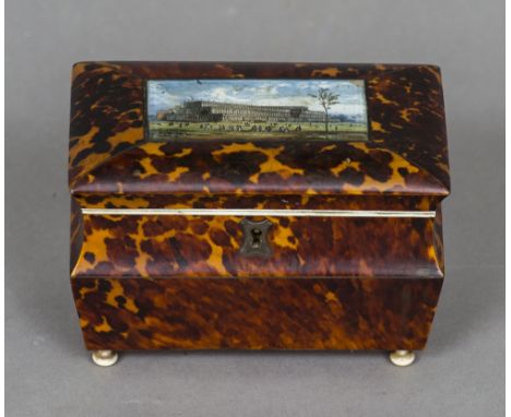 A Victorian tortoiseshell tea caddy
The domed hinged top inset with a view of the Great Exhibition 1851, enclosing twin lidde