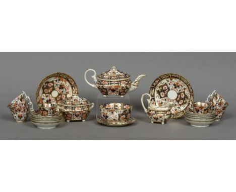 A 19th century Crown Derby ten setting tea service
Decorated in the Imari palette, comprising: a teapot, a milk jug, a sucrie