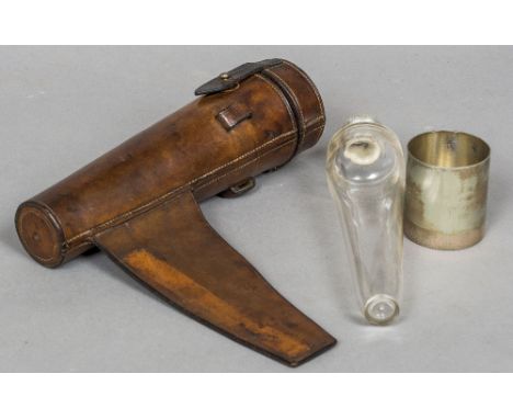 A late 19th/early 20th century silver plate mounted clear glass stirrup flask
With plated beaker, housed in a polished leathe