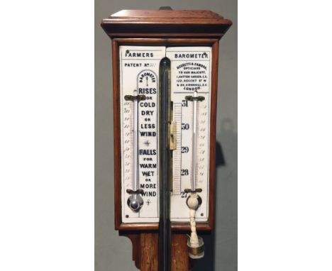 A Negretti & Zambra oak farmer's barometer
The signed white ceramic dial with twin thermometer scales and barometer scale, th