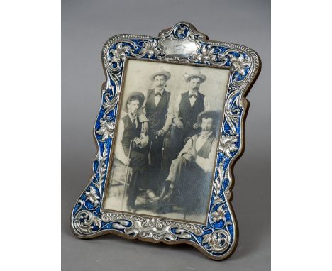 An Art Nouveau silver and blue enamelled photo frame, hallmarked Birmingham 1905, maker's mark of Charles S. Green & Co
Worke