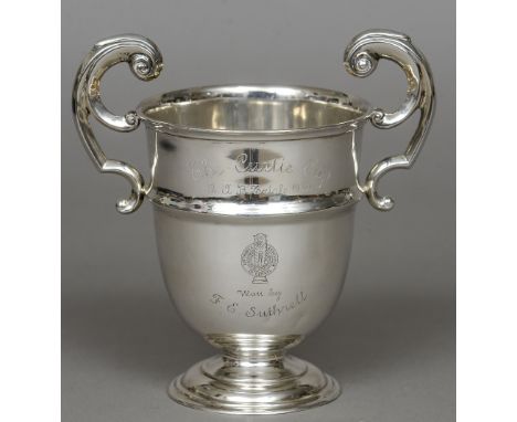 A Sterling silver twin handled trophy cup, hallmarked for Sterling Standard, maker's mark indistinct
The body with Automobile