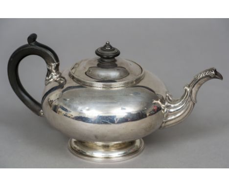 A George IV silver teapot, hallmarked London 1824, maker's mark of William Esterbrook
Of compressed spherical form with cast 
