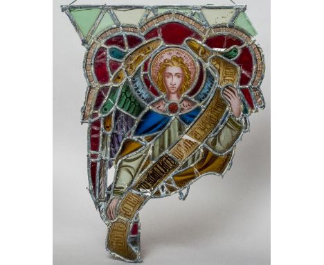 A pair of stained glass panels
Of shaped outline, centred with a saintly portrait.  45 cm wide.  (2) CONDITION REPORTS: Somew