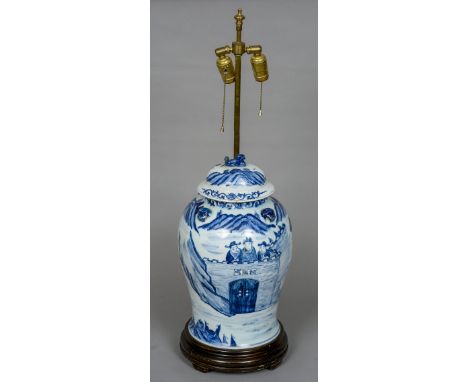 A large Chinese blue and white porcelain lidded vase
The lid with dog-of-fo finial above the bulbous main body, decorated wit