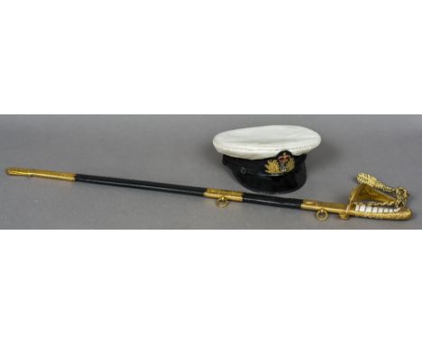 A Royal Naval Officer's dress sword and scabbard and peaked cap 
The sword 93 cm long.  (2)

Note: Having previously belonged