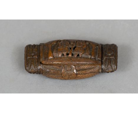 A 19th century carved coquilla nut snuff box
Of rounded rectangular form and decorated with classical figures.  9 cm wide.  C
