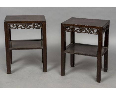 A pair of 19th century Chinese hardwood stands
Each panelled rectangular top above the pierced scroll carved frieze, standing