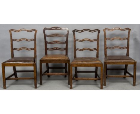 A harlequin set of eleven 19th century mahogany ladder back dining chairs
Each with overstuffed brown leather drop-in seats. 