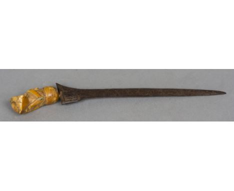 A 19th century kris
Of typical form, mounted with a carved ivory handle.  32 cm long.  CONDITION REPORTS: Vacant recess to to