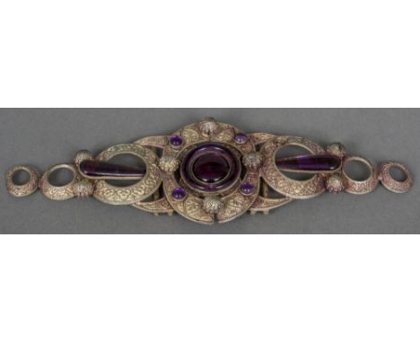 A French Art Nouveau amethyst celluloid mounted white metal belt buckle by Piel Freres
17 cm wide.  CONDITION REPORTS: Genera