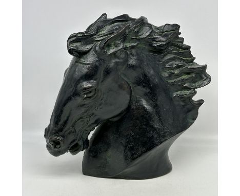 A large ceramic horses head, 12 inches x 12 inches