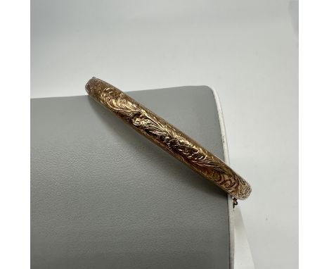 A 9ct yellow gold bangle, will need restored, weight 6.7 grams approx, has a lovely design on the front, 7 1/2 inches