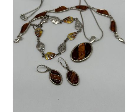 A large mixed lot of silver &amp; amber items