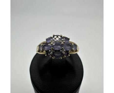 A 9ct yellow gold Tanzanite stone set dress ring, 11 Tanzanite stones, size P, weight 2.5 grams approx