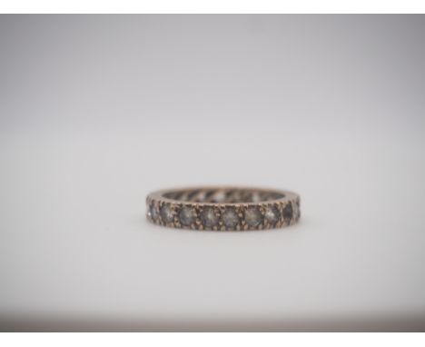 A 9ct yellow gold full eternity ring, cz stone set, one stone is missing, size L, weight 2.7g approx