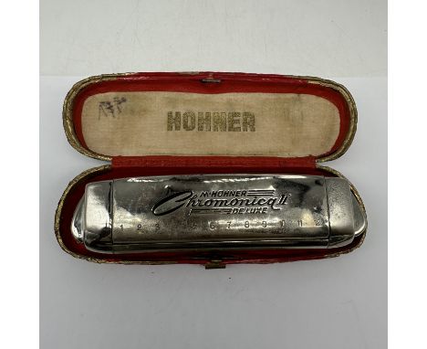 A vintage Hohner mouth Chromonica II Deluxe, comes in original case