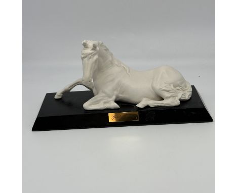 A white Spirit of Peace horse on wooden base, no box