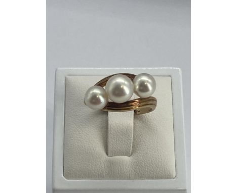 A 14ct yellow gold 3 stone cultured pearl ring, 3 stone cultured pearl, 5.7 grams in weight approx, size Q