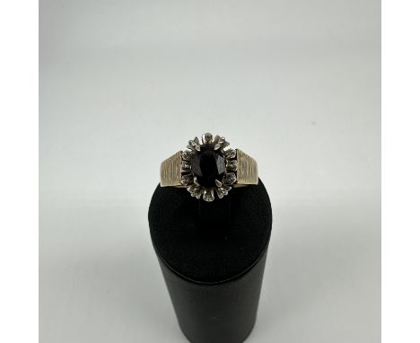 A 9ct yellow gold garnet stone ring, size S, weight 4.3 grams approx