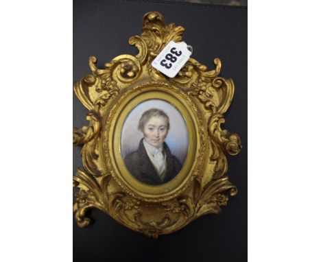 A mid 19th Century oval portrait miniature of John Stacey of Church Street Sheffield. 7 x 6cm. Gilt framed. Together with a m