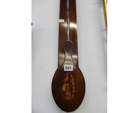 A 19th Century mahogany stick barometer. Unsigned silver dial with thermometer. Period crest to case and shell inlaid reservo