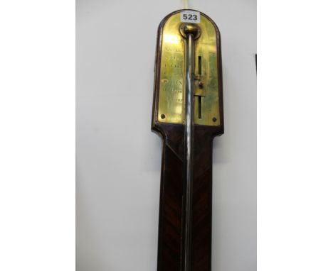 An early 19th Century mahogany stick barometer, Dolland, London. Arched top, engraved brass scale 28-31” the trunk with mould