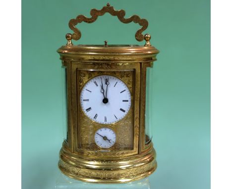 A late 19th Century French oval carriage clock with repeater action, twin train alarm with hour subsidiary dial. The case cha