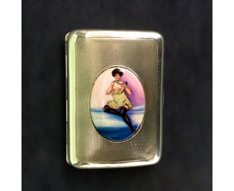 A silver and enamel cigarette case. With enamelled risque scene. London 1919. Maker Sampson Mordan &amp; Co. 8 x 6cm.