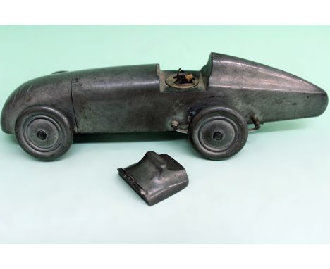 A circa 1930s pewter table lighter. Modelled in the form of a Magic M G Midget motor car. 19cm long. pat no 373219.