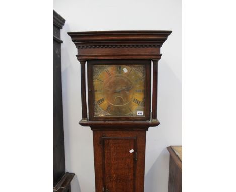 A late 18th Century brass faced oak longcase clock with thirty hour movement. 28cm square dial. Maker Plimer Wellington. 190c