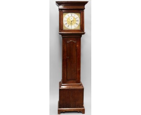 An 18th Century oak cased eight day longcase clock. Brass dial and spandrels. Silvered chapter ring with Roman and Arabic num