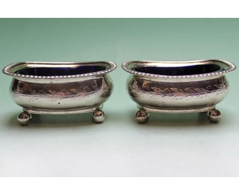 A pair of George III silver table salts with Bristol blue glass liners. M&R.