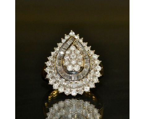 A diamond pear drop cluster ring, quartetto top inset with fifty four round and thirty eight baguette cut diamonds, total est