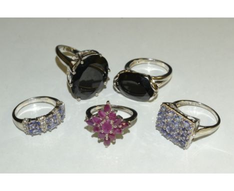 Rings - a tanzanite and white topaz dress ring, size O;  others Tanzanite and zircon;  size S;  ruby,  size O;  black spinel 