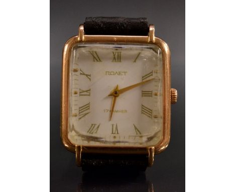 Novet/Poljot - a Soviet Russian 15ct gold tonneau wristwatch, white dial, gold coloured Roman numerals, minute track, ridged 