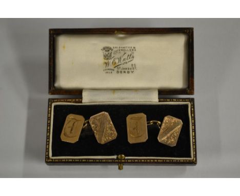 A pair of canter rectangular 9ct gold cufflinks, floral and initialed matrix ends, stamped 9ct gold, 8.6g gross, cased