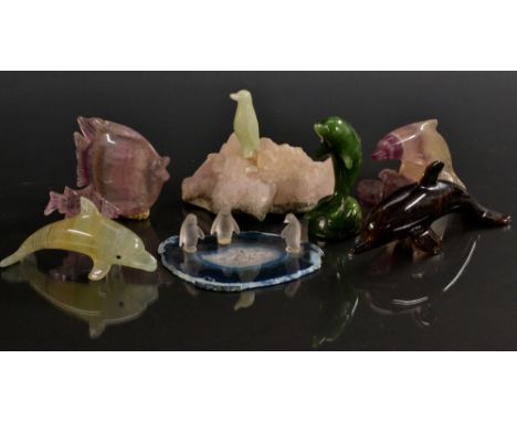 Geology - a carved flourite dolphin, leaping over a calcite base;  others Tigers eye, Canadian green jade,  purple banded flo