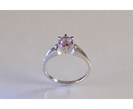 A pink sapphire solitaire ring, round brilliant cut, approx 0.55ct, six claw crown, 9ct white gold shank, size N, 2.3g gross