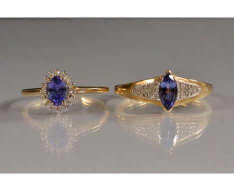 A Tanzanite and diamond oval cluster ring, central oval tanzanite surrounded by a band of diamond accents, 9ct gold shank, st