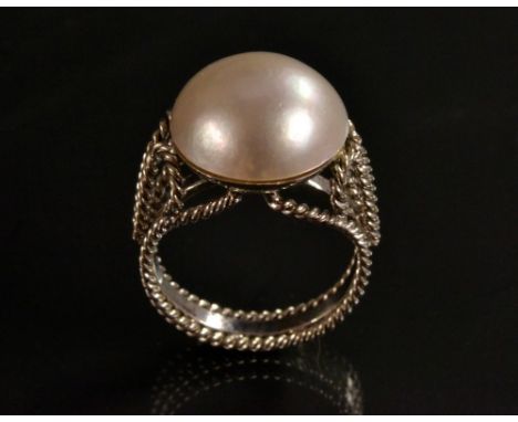 A half pearl dress ring, pinky white tone single cultured half pearl, rope work silver metal shank, boars head mark, size M, 