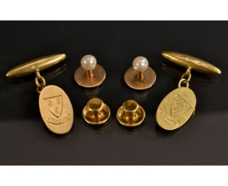 A pair of 18ct gold oval and torpedo bar cufflinks, engraved with three corn sheaf's within a shield, above Vincit Qui Patitu