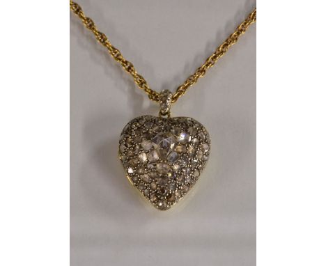 A diamond encrusted heart pendant locket, pave rough and rose cut diamond encrusted front, total estimated diamond weight app