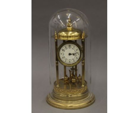 A 1920's German 400-day anniversary clock under a glass dome. 42 cm high overall.