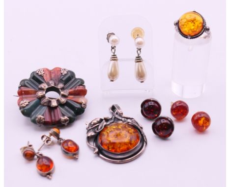 A quantity of silver jewellery to include: earrings, an Art Nouveau style pendant, a ring and a Scottish agate brooch.  Penda