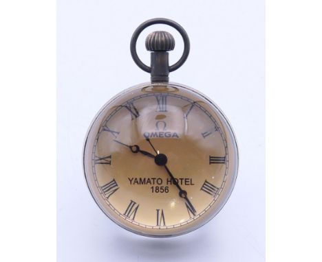A ball clock.  7 cm high overall.